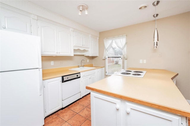 kitchen with light tile patterned floors, white appliances, a sink, white cabinets, and light countertops