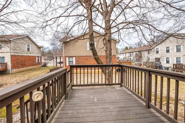 wooden terrace featuring a residential view