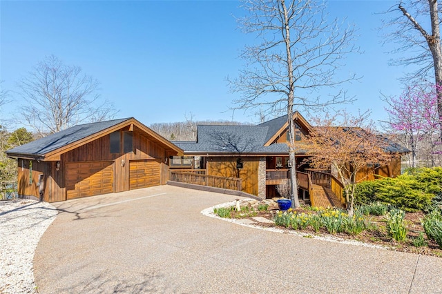 rustic home with aphalt driveway