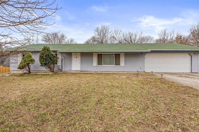 ranch-style house with a garage, driveway, and a front lawn