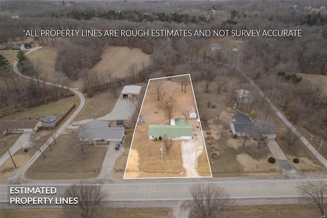 birds eye view of property with a rural view