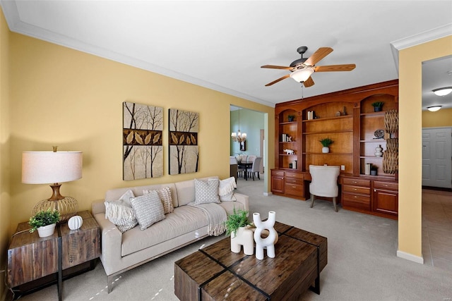 carpeted living room with a ceiling fan and crown molding