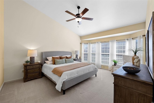 bedroom with a ceiling fan, light carpet, high vaulted ceiling, and multiple windows