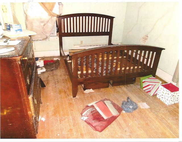 bedroom with wood finished floors