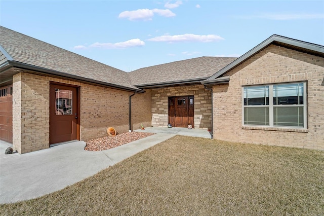 view of front of home featuring a shingled roof