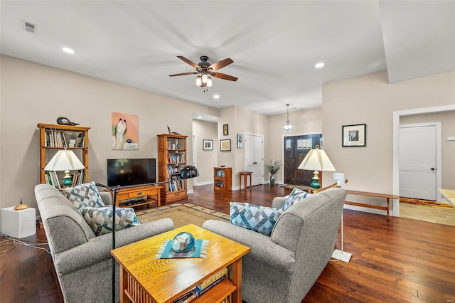 living room featuring recessed lighting, visible vents, baseboards, and hardwood / wood-style floors