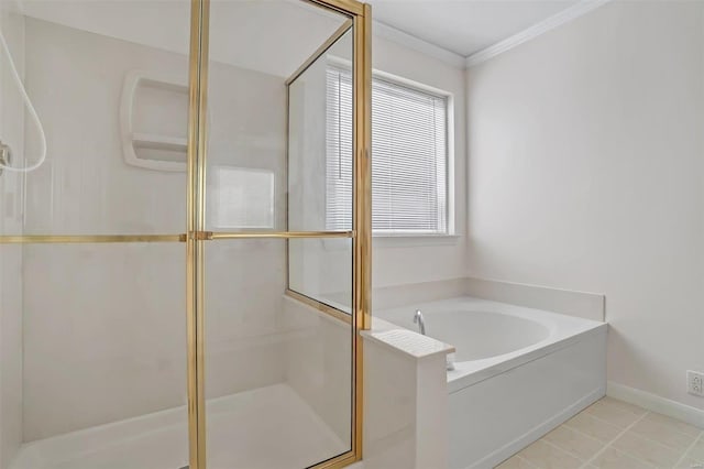 full bathroom with tile patterned floors, a stall shower, ornamental molding, baseboards, and a bath