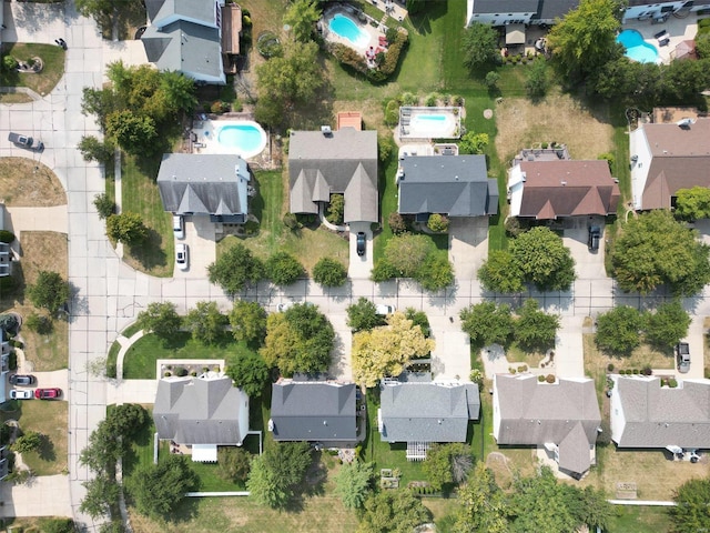 birds eye view of property with a residential view