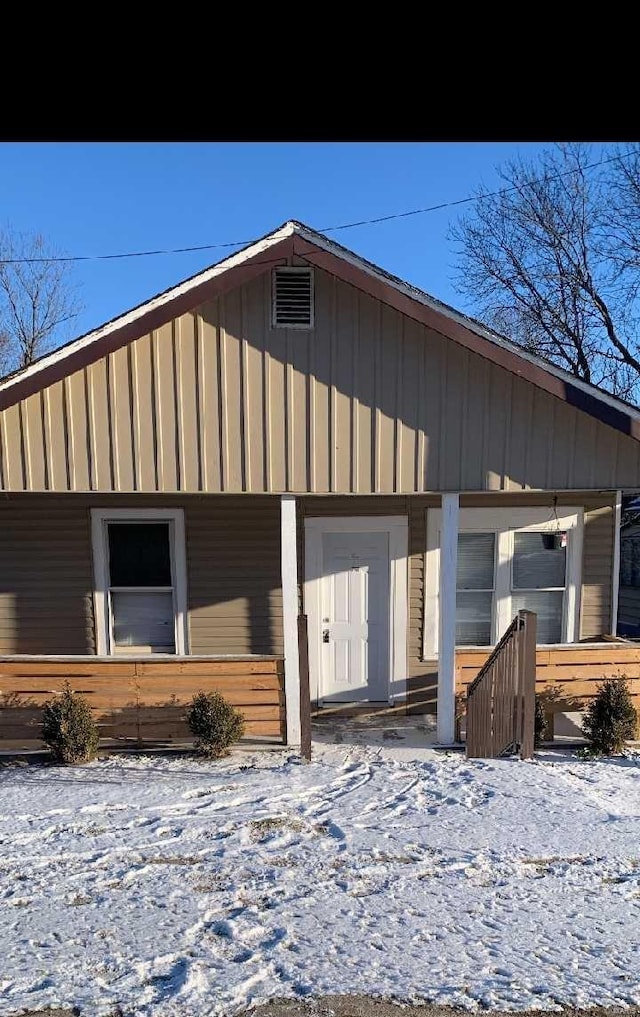 view of front of home with covered porch and board and batten siding