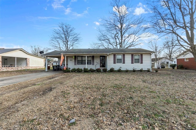 single story home featuring a carport and concrete driveway