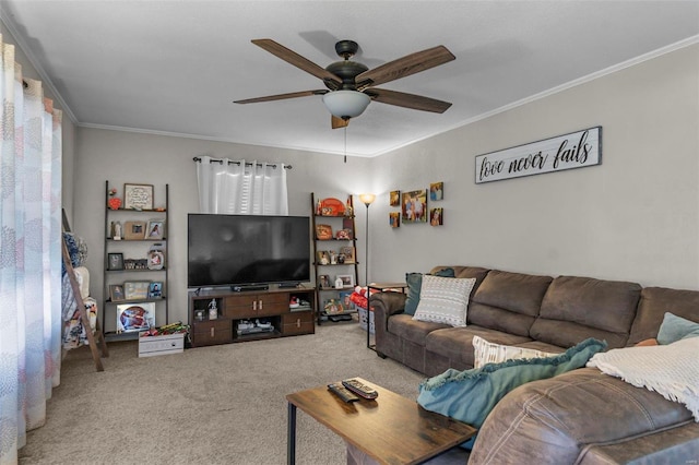 living room featuring ornamental molding, carpet, and a ceiling fan