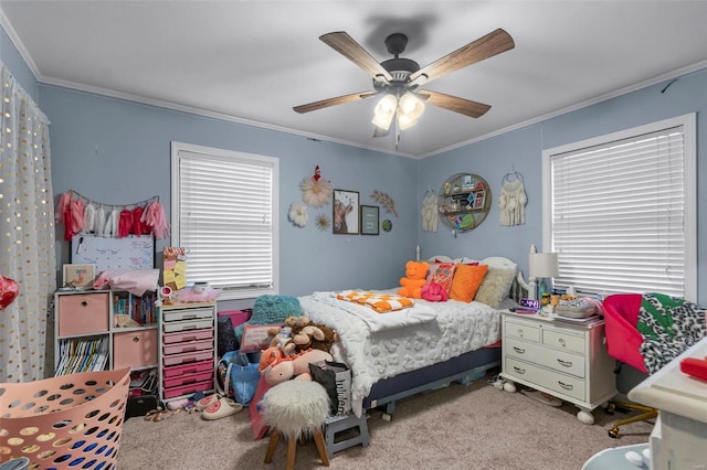 bedroom featuring carpet, crown molding, and ceiling fan