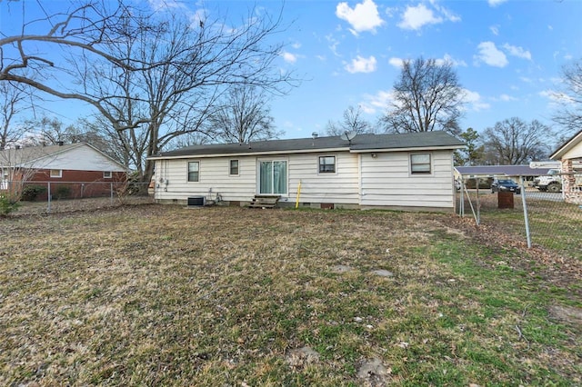 rear view of property with entry steps, central AC, fence, and a lawn