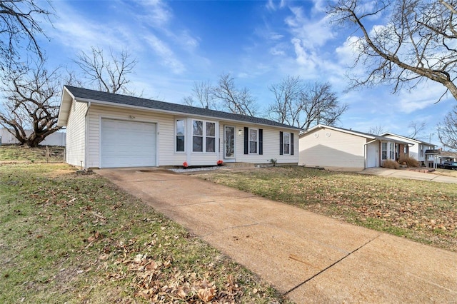 ranch-style house with an attached garage, driveway, and a front lawn