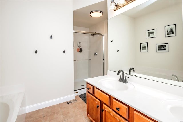 full bath featuring a garden tub, visible vents, a stall shower, a sink, and tile patterned floors