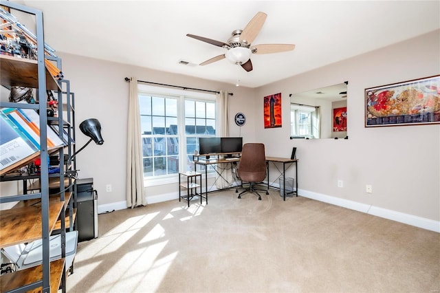 carpeted office space with visible vents, baseboards, and a wealth of natural light