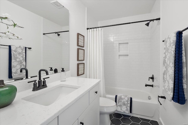 full bath with toilet, shower / tub combo, visible vents, and vanity