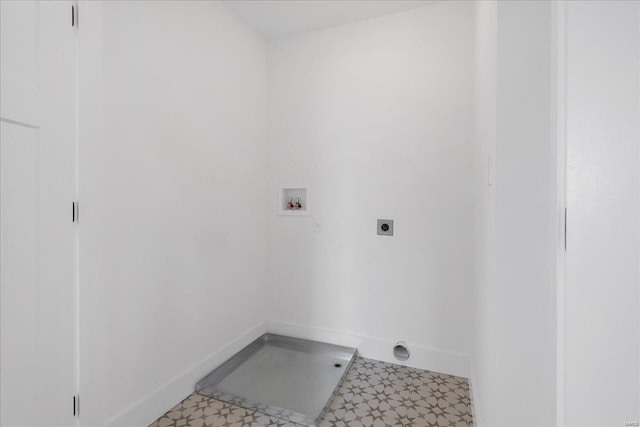 laundry room featuring laundry area, baseboards, tile patterned floors, hookup for a washing machine, and electric dryer hookup