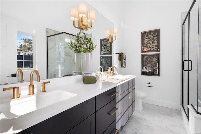 full bathroom featuring marble finish floor, double vanity, a sink, and a shower stall