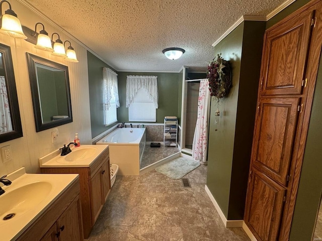 full bath featuring a textured ceiling, a sink, a garden tub, and a shower stall