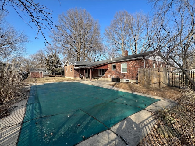 view of pool with a patio area, fence, and a fenced in pool