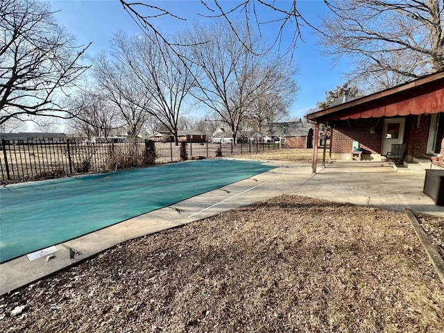 view of pool with a patio area, fence, and a fenced in pool