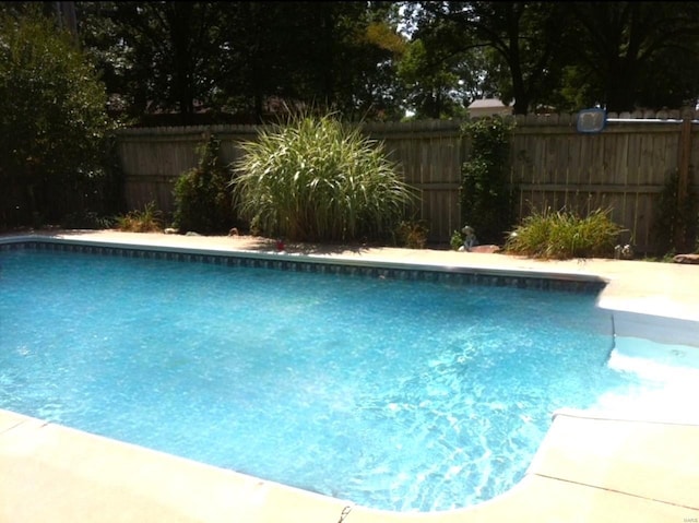 view of swimming pool featuring fence and a fenced in pool