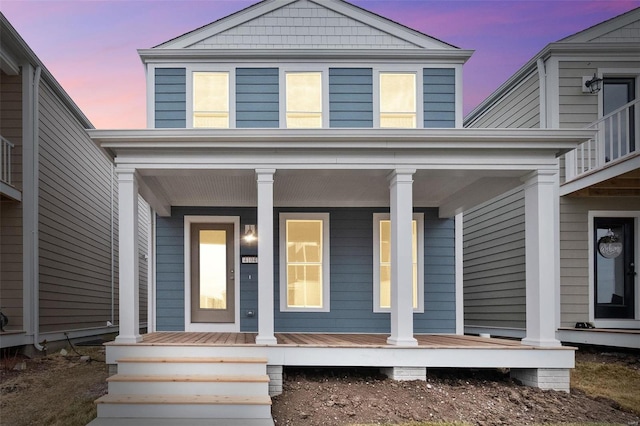 entrance to property featuring covered porch