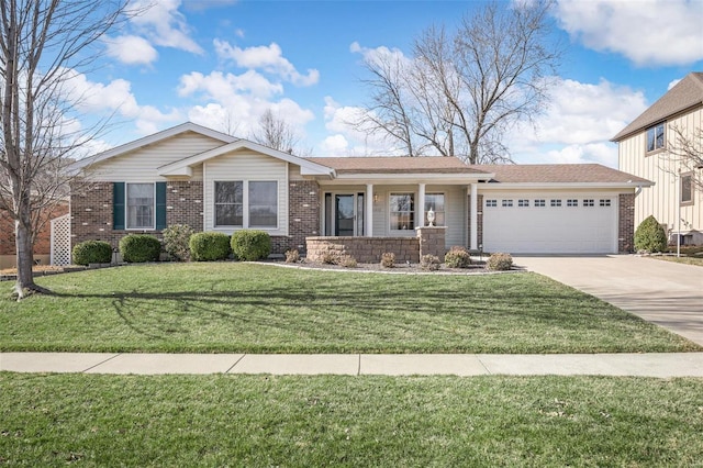 view of front of home featuring brick siding, a front lawn, concrete driveway, and a garage