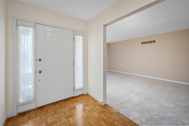 entrance foyer featuring visible vents and baseboards