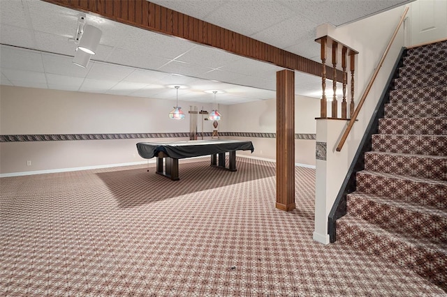 rec room featuring carpet flooring, a paneled ceiling, and baseboards