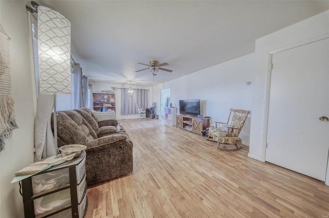 living area featuring ceiling fan and wood finished floors