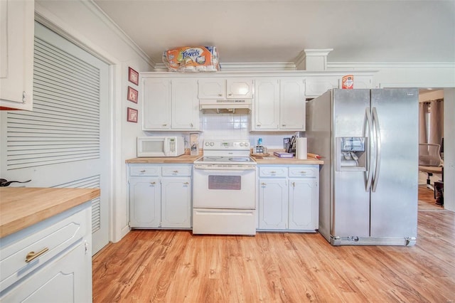 kitchen with light wood-type flooring, ornamental molding, under cabinet range hood, white appliances, and decorative backsplash