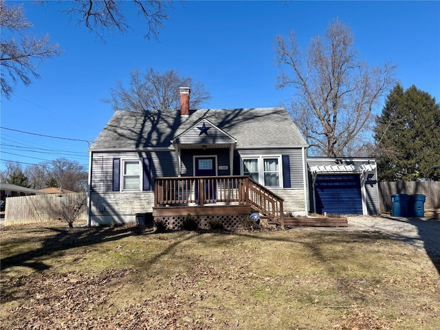 view of front of property with dirt driveway, a deck, and fence