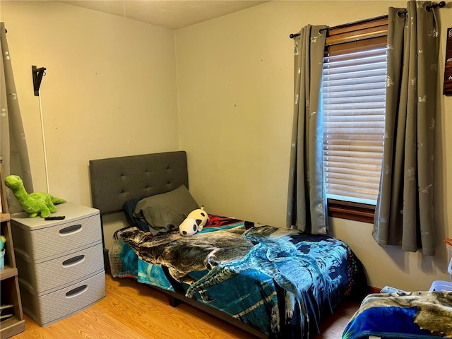 bedroom featuring light wood-style floors