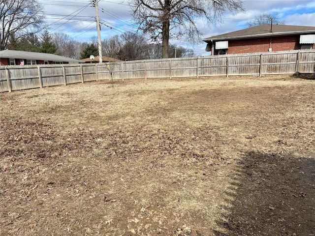 view of yard featuring a fenced backyard