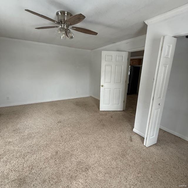 unfurnished bedroom with light carpet, refrigerator, a ceiling fan, and baseboards