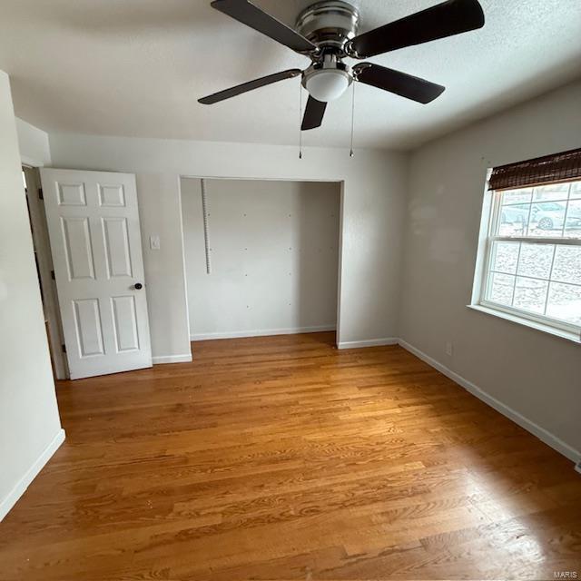 spare room with light wood-style flooring and baseboards