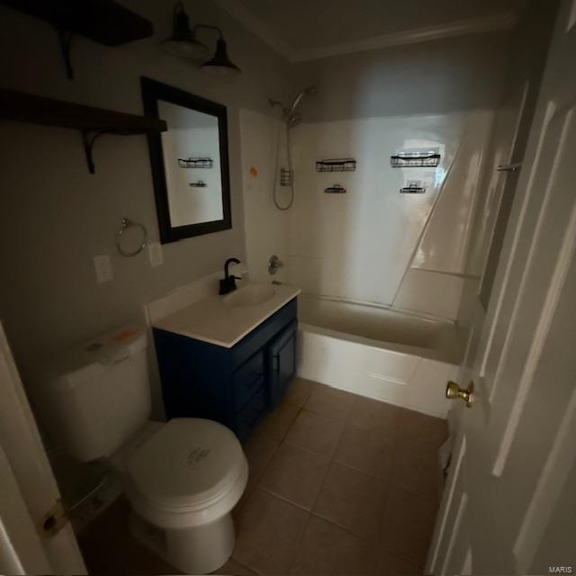 full bath with vanity, shower / tub combination, toilet, and tile patterned floors