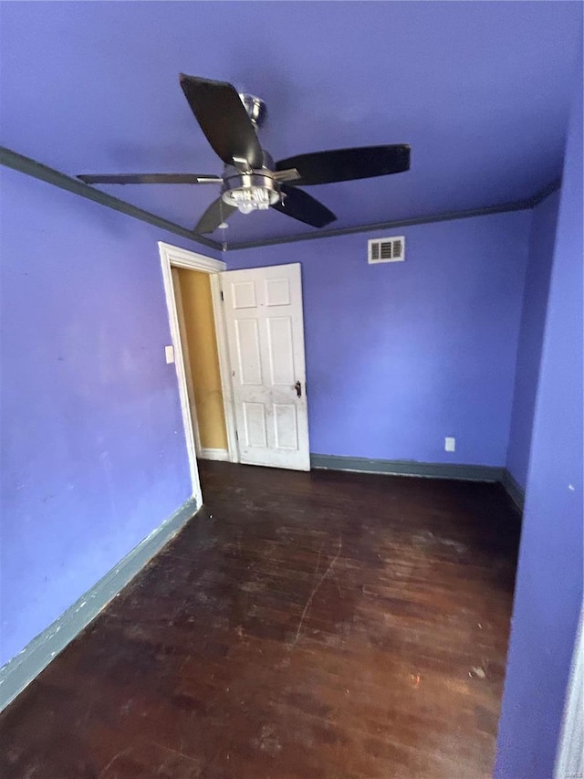 unfurnished bedroom featuring baseboards, visible vents, ceiling fan, and wood finished floors