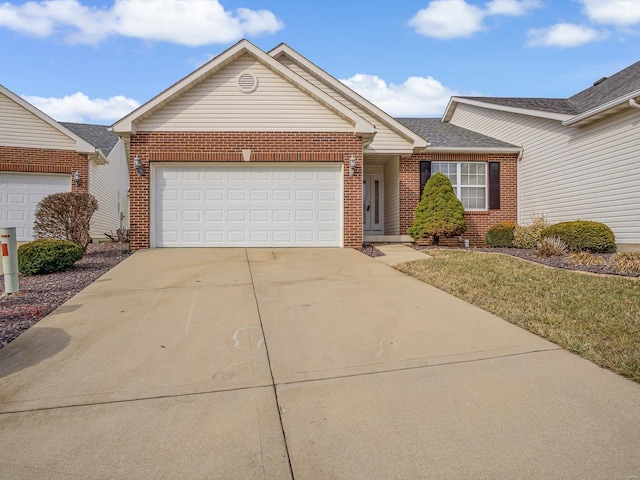 ranch-style home with a garage, concrete driveway, and brick siding