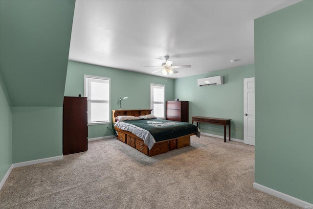 bedroom featuring carpet floors, baseboards, a ceiling fan, and a wall mounted AC