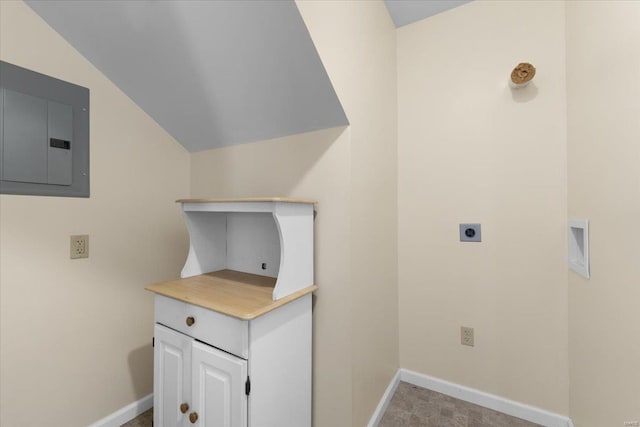 washroom with baseboards, laundry area, electric dryer hookup, and electric panel