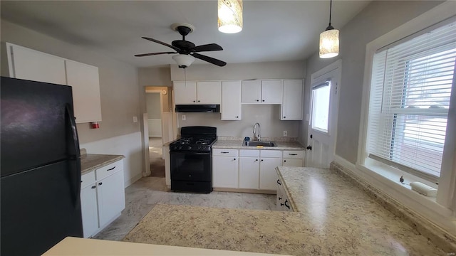 kitchen with black appliances, under cabinet range hood, white cabinetry, and a sink