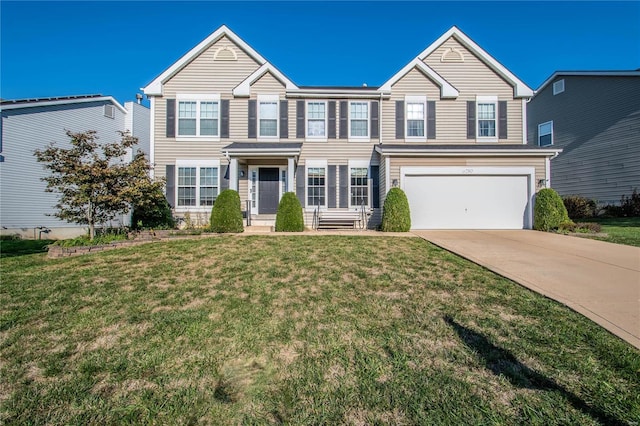 view of front of house featuring driveway, an attached garage, and a front yard