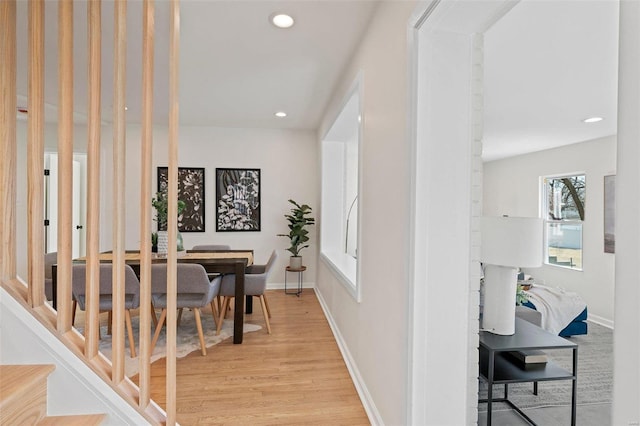 hall with recessed lighting, baseboards, and light wood-style floors