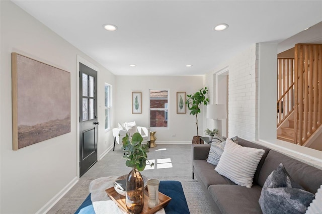 living area featuring stairway, recessed lighting, and baseboards