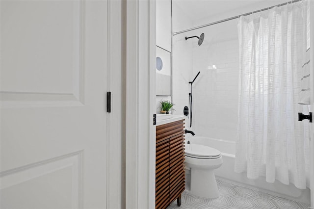 bathroom featuring tile patterned floors, toilet, shower / bath combo, and vanity