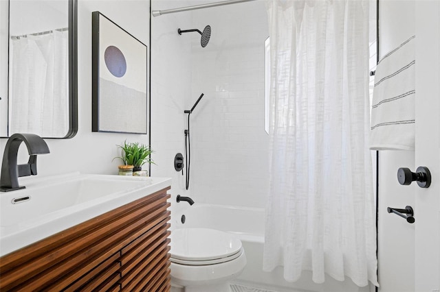 bathroom featuring vanity, toilet, and shower / bath combo