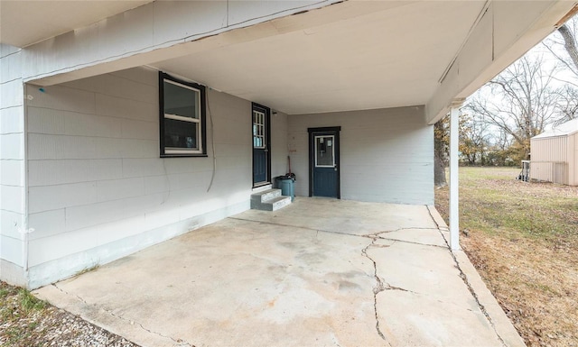 view of patio / terrace featuring entry steps and a carport